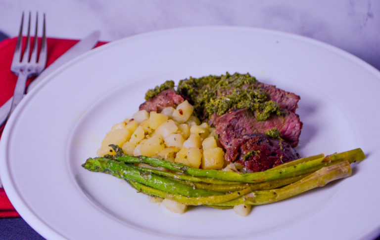 Sirloin with chimichurri sauce, roasted potatoes and steamed asparagus